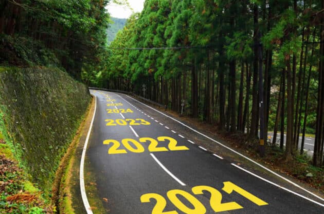 A road with the upcoming years written on it in yellow.