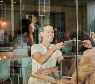 A women enjoying a coffee with a man.